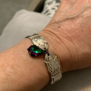 Silver bracelet made from silverware.